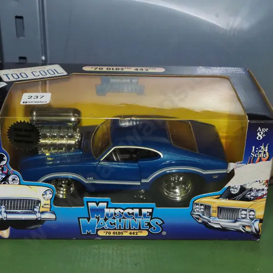 boxed diecast scale model of muscle machine oldsmobile