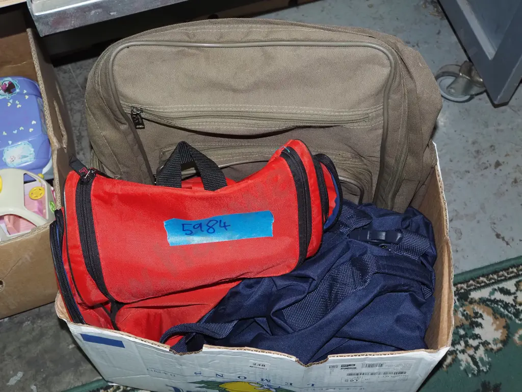 box of backpacks and bags Image 1++