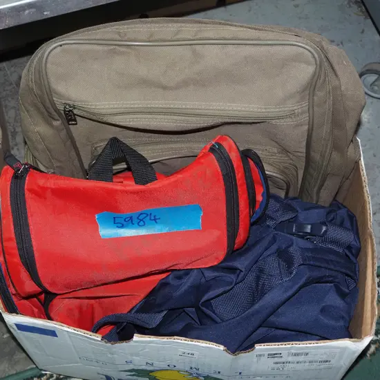 box of backpacks and bags