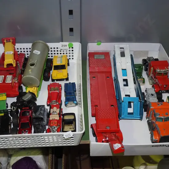 2x trays of toy vehicles - green dots