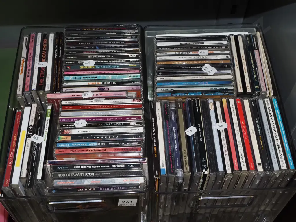 2x plastic tubs of CDs Image 1++