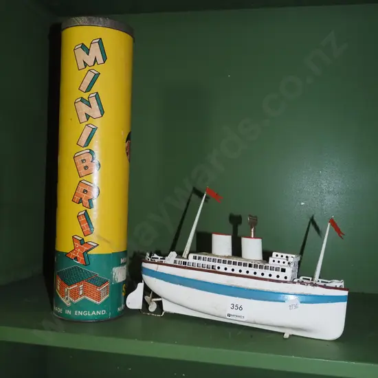 clockwork tin boat, lidded canister of mini bricks