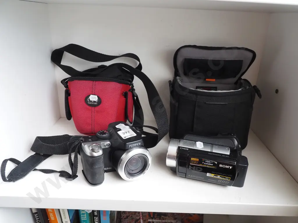 Fuji digital camera, Sony handi cam - both have bags Image 1++