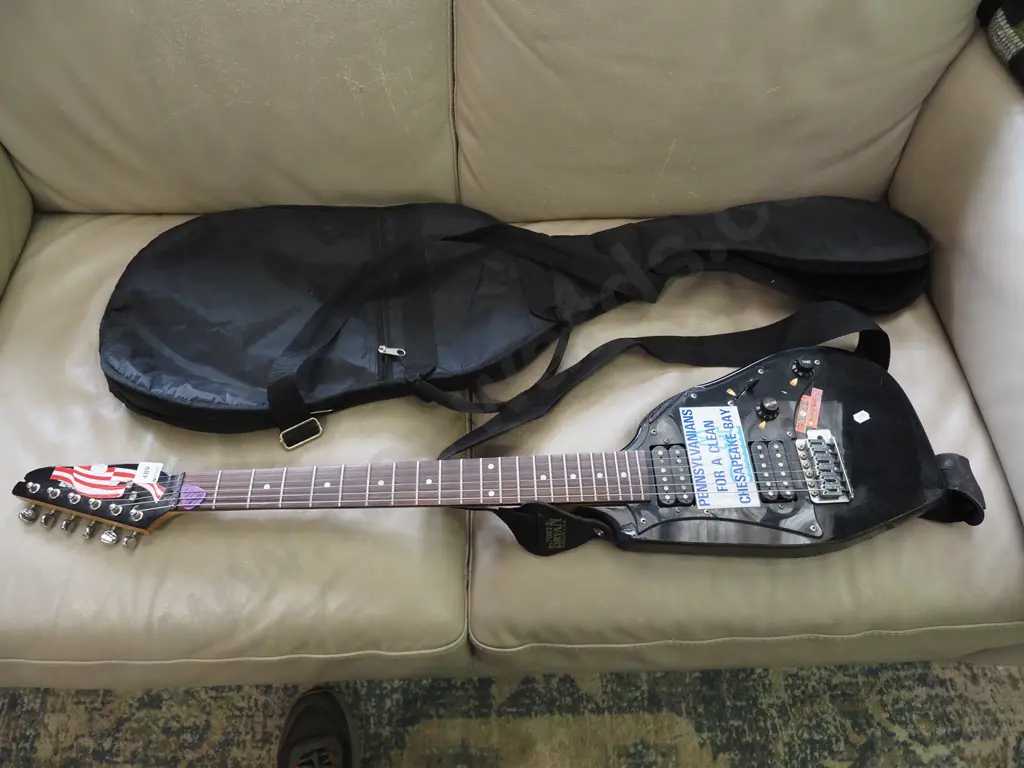 electric guitar that has been cut down, carry bag Image 1++