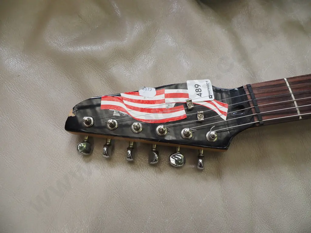 electric guitar that has been cut down, carry bag Image 1++
