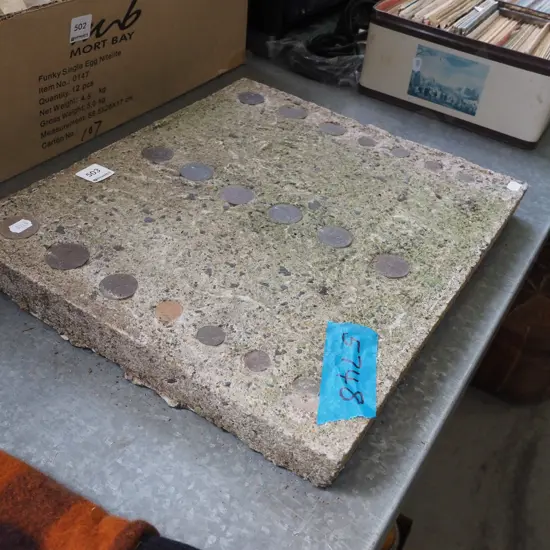 home made concrete tile with imbedded coins