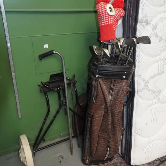 golf clubs and trundler