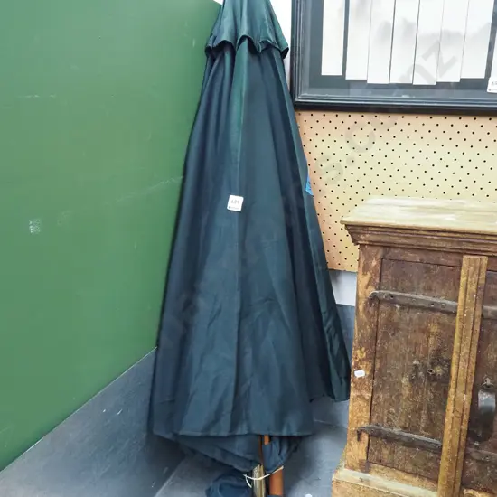 small green fabric sun umbrella