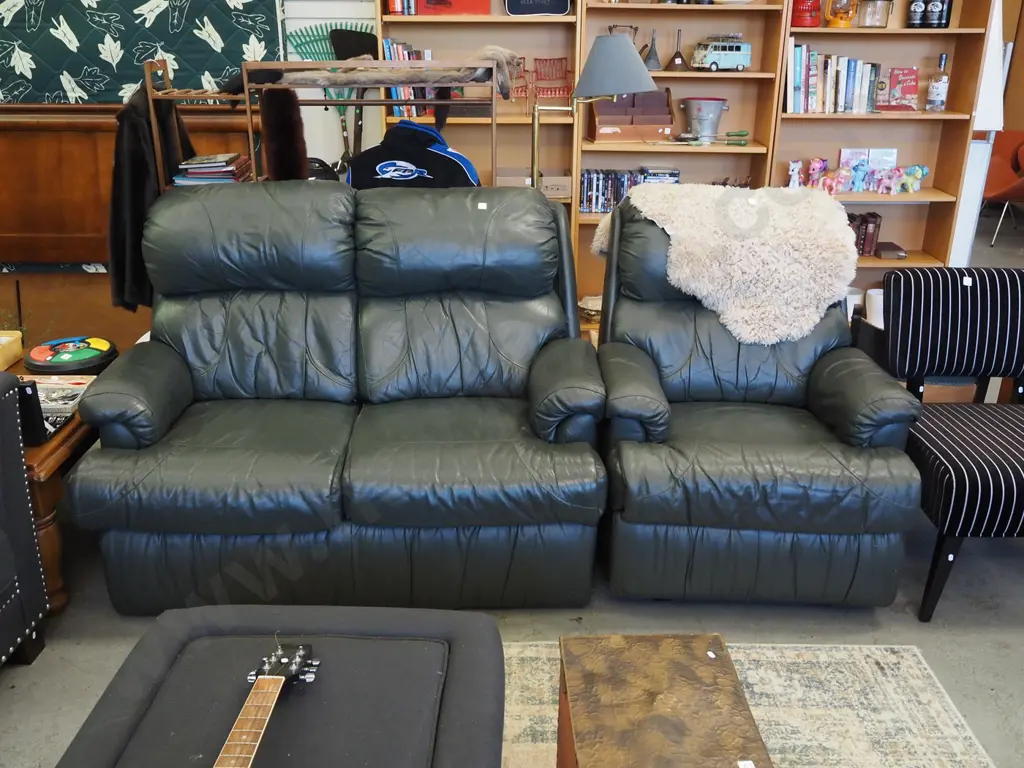 green leather 2 piece lounge suite -  2 seater, single recliner has damage to handle Image 1++