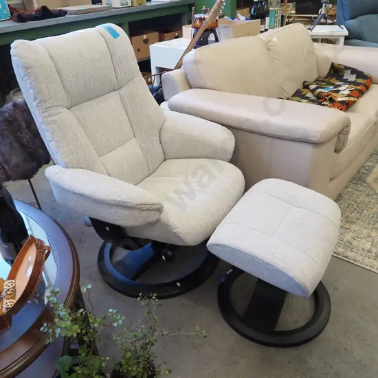 swivel reclining armchair with matching footstool with fawn upholstery - excellent condition