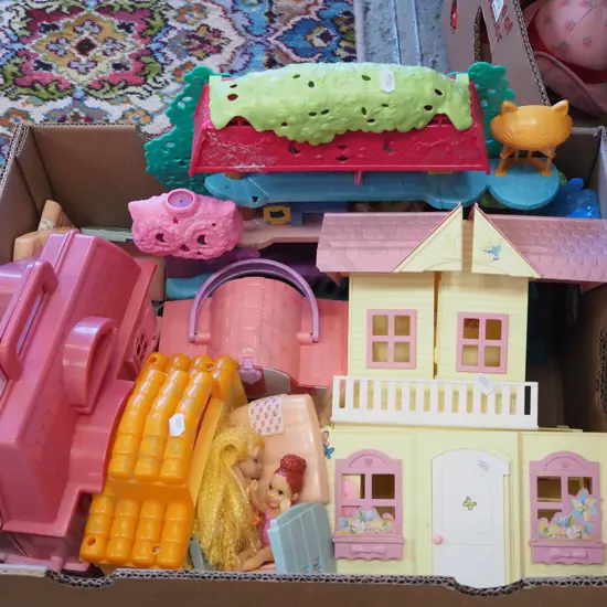 box of plastic dollshouse toys