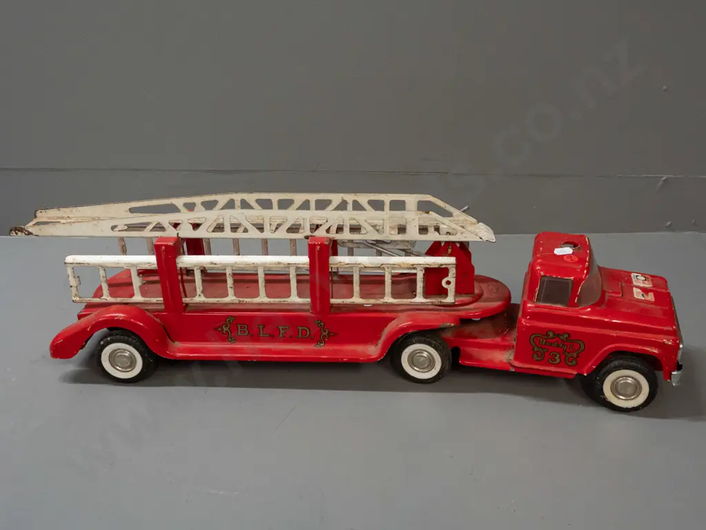 large tin toy vehicle - Buddy L "BLFD" fire engine with spring suspension and ladder - missing cab light and some Image 1++