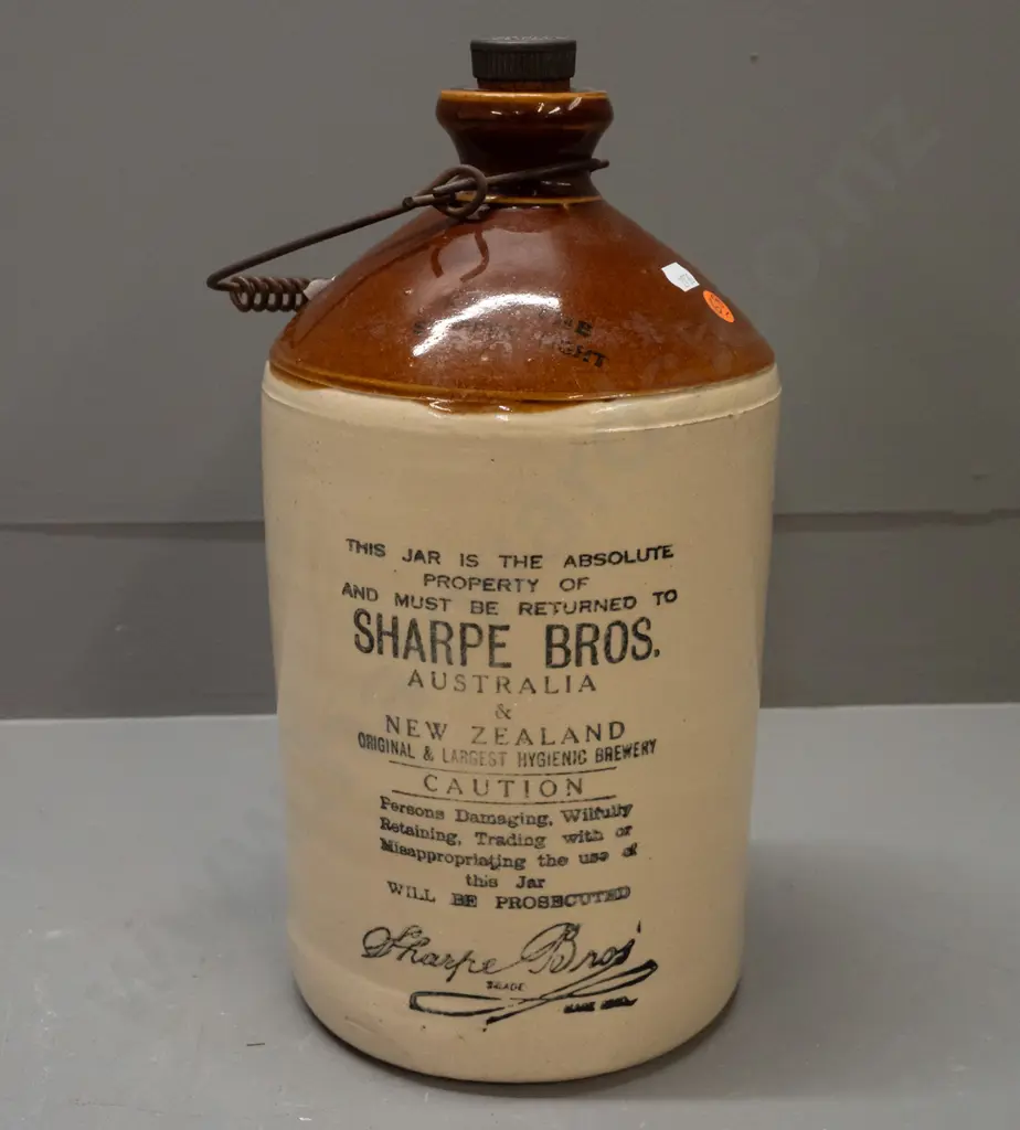 stoneware crock with wire handle and original bakelite stopper - marked Sharpe Bros. Australia and New Zealand - some Image 1++