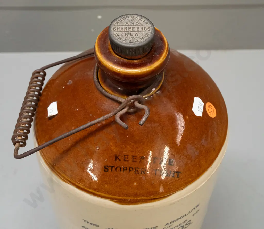 stoneware crock with wire handle and original bakelite stopper - marked Sharpe Bros. Australia and New Zealand - some Image 1++