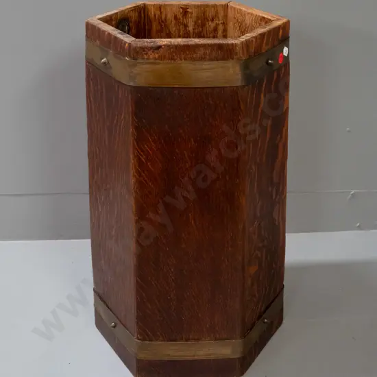 hexagonal oak umbrella / stick stand with drip tray, brass strapping, applied metal plaque w/ RA LIster & Co Ltd England