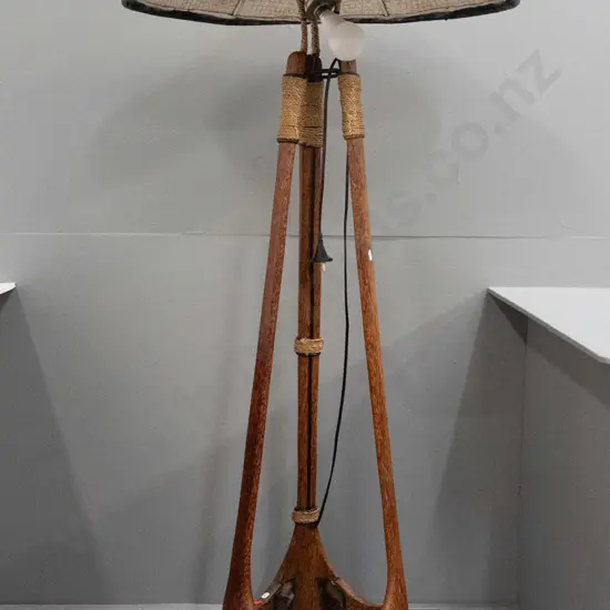 unusual (asian?) tripod shaped timber and metal framed standard lamp with cord binding, stapled plates and woven cane