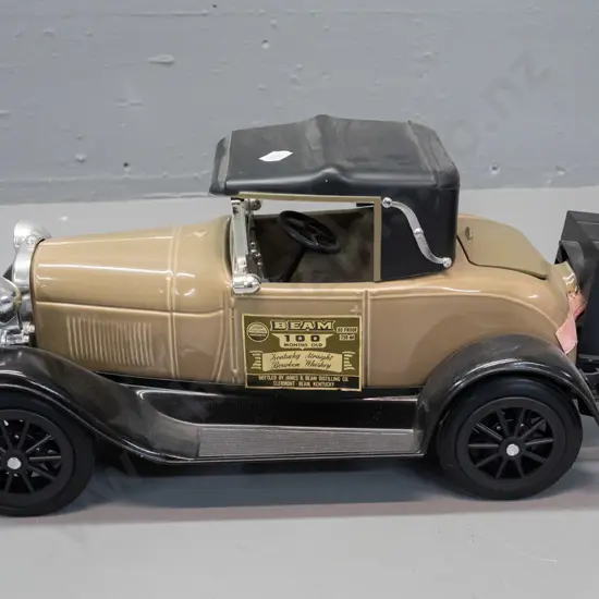 Jim Beam automobile decanter - 1928 Ford with fold-up rumble seat - sealed, minor damage to paper seal H-170 L-350