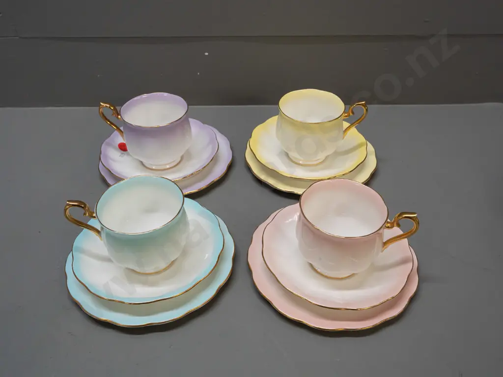 4 Royal Albert "Rainbow" trios in various colours, with gilt handles and rims Image 1++