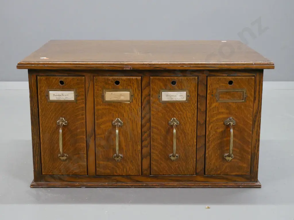 vintage oak desktop filing cabinet with 4 vertical drawers with brass handles and label holders - Image 1++