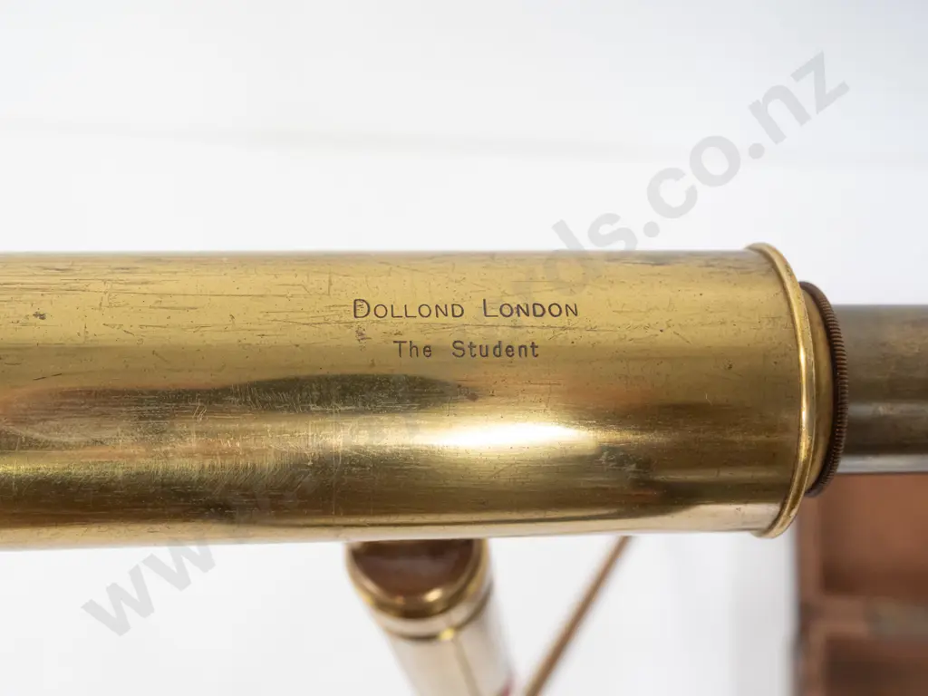 vintage brass telescope marked Dollond London "The Student" and matching tripod stand in fitted oak case. Some damage to Image 1++