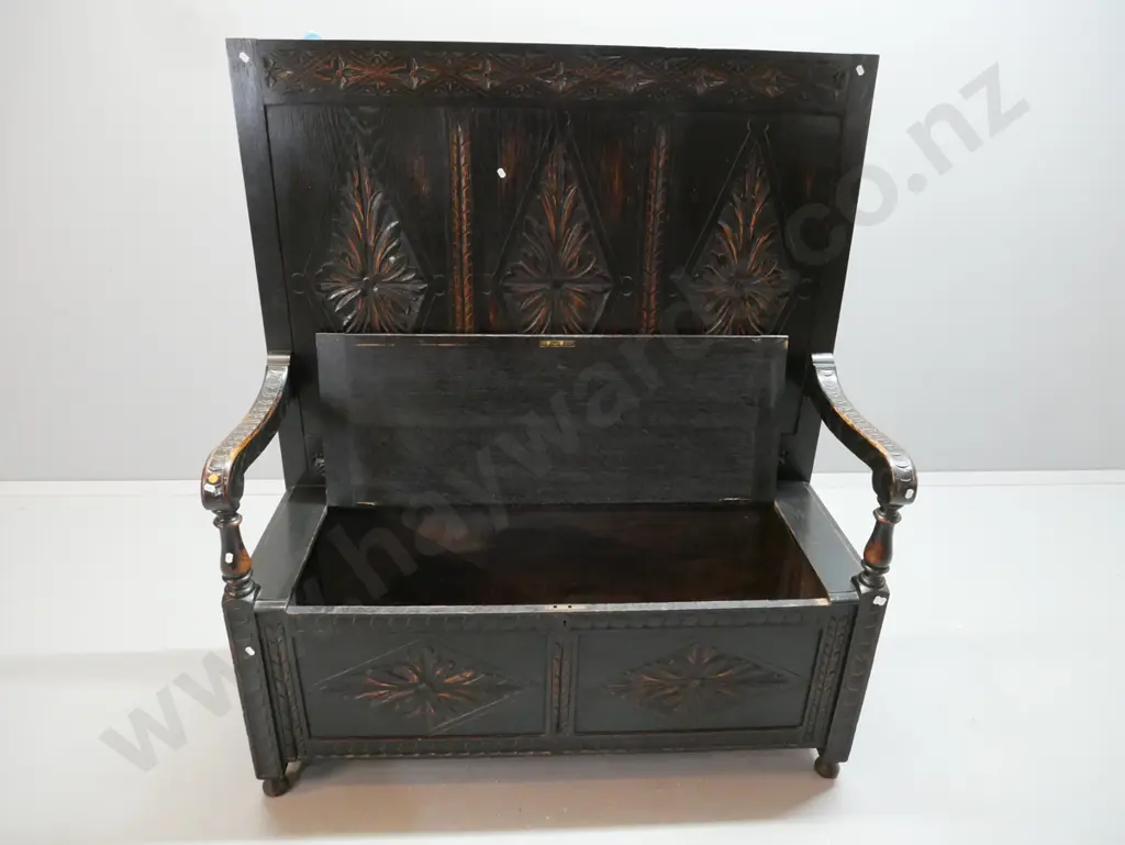 Victorian oak gothic revival settle with foliate diamond carved 3-panel back, arms and 2-panel front, lift up seat. Has Image 1++