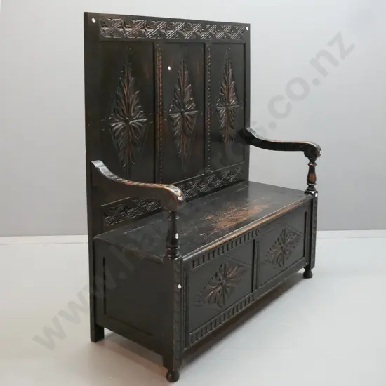 Victorian oak gothic revival settle with foliate diamond carved 3-panel back, arms and 2-panel front, lift up seat. Has