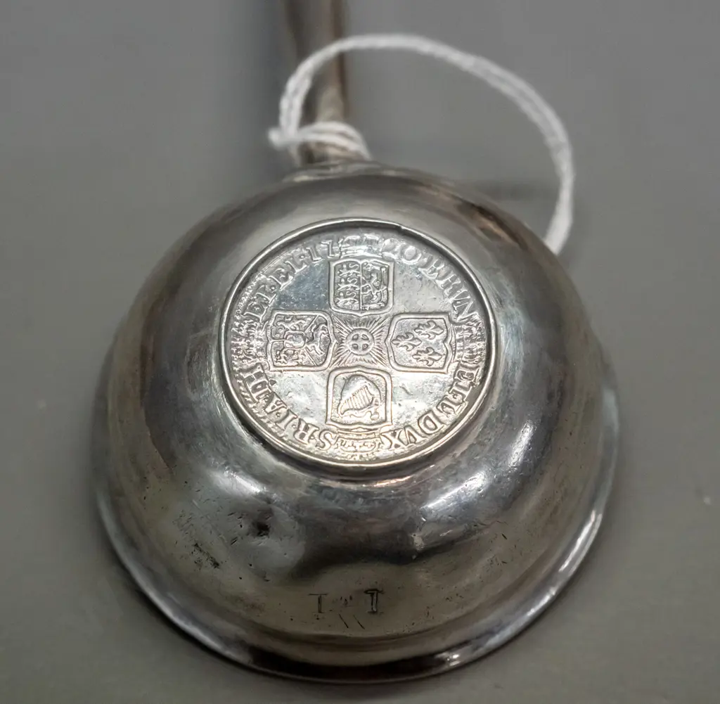 silver toddy ladle with balleen handle and inset coin marked Georgius Rex, date 1720. Some denting to bowl. L-240 Image 1++