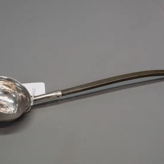 silver toddy ladle with balleen handle and inset coin marked Georgius Rex, date 1720. Some denting to bowl. L-240