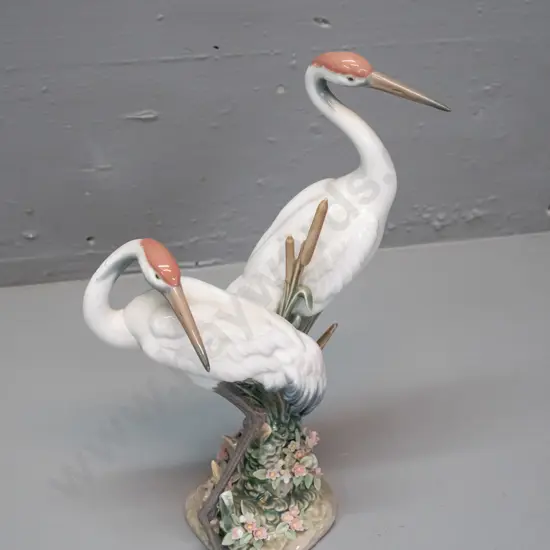 Lladro bird figure - pair of cranes with fine floral and reed detail around base H-280
