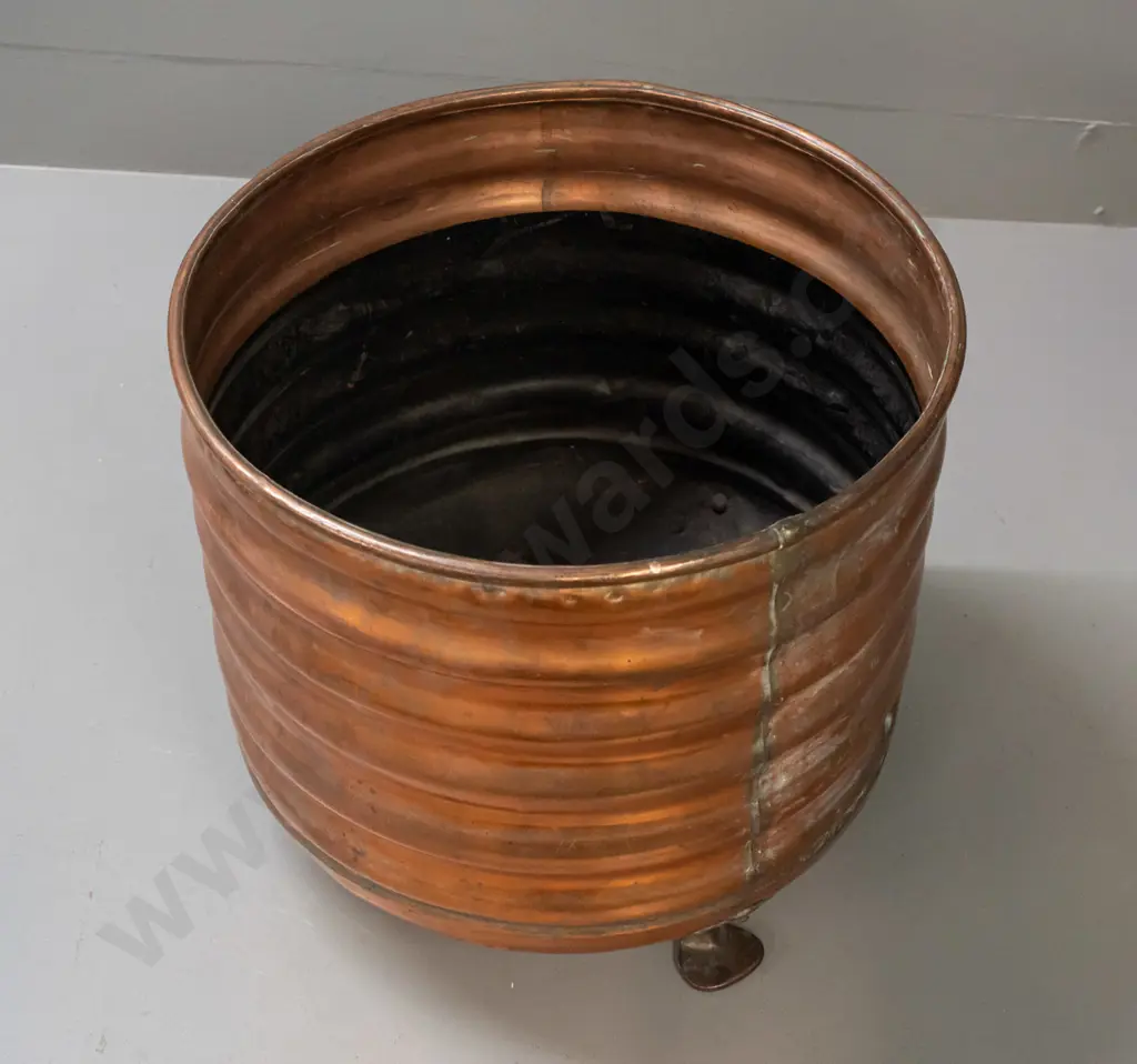 ribbed copper wood bin on 3 copper-plated feet, some dents and wear to painted interior, patched repair in bottom H-340 Image 1++