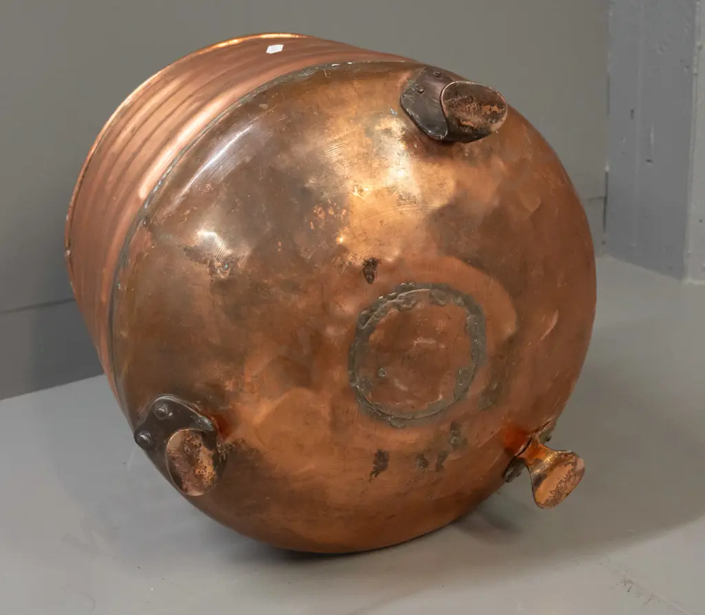 ribbed copper wood bin on 3 copper-plated feet, some dents and wear to painted interior, patched repair in bottom H-340 Image 1++