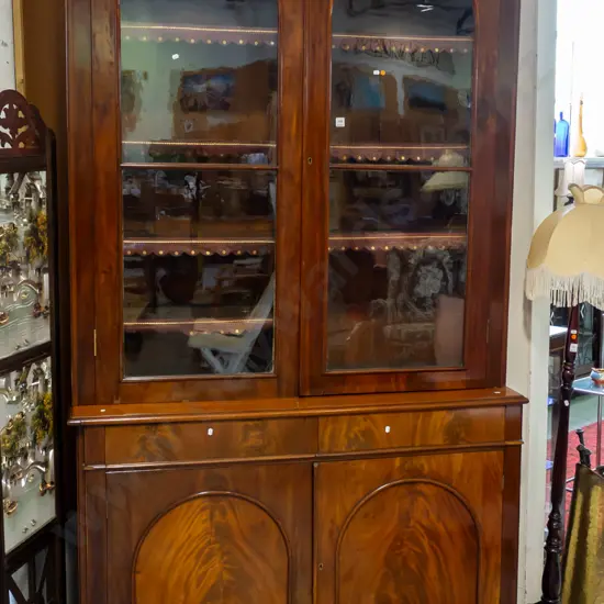 Victorian flame mahogany bookcase chiffonier, dentil moulding to cornice, 2 arched glazed cupboard doors, 8 adjustable