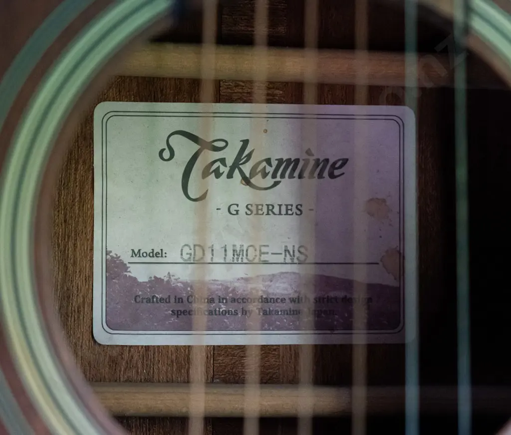 Takamine dreadnought acoustic guitar model GDE11MCE-NS in Ashton hard case. Minor usage wear and scratches, minor areas Image 1++