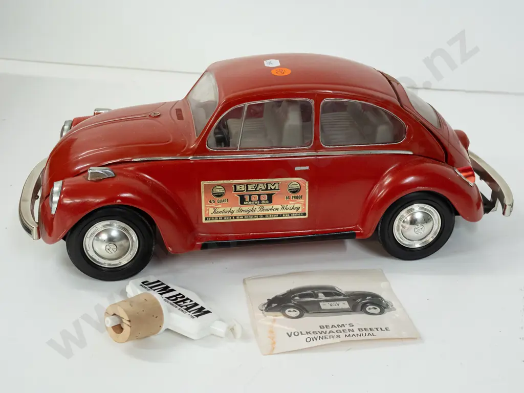 Jim Beam automotive decanter - 1973 red VW Beetle, with contents, seal intact, with a pourer and manual L-370 Image 1++