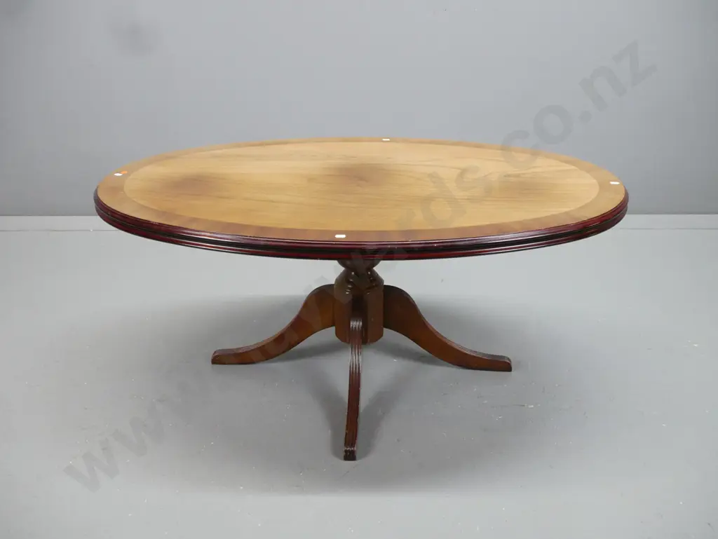 walnut and elm oval coffee table pedestal base with 4 sweeping reeded legs, cross-banded edge, some fading & heat marks Image 1++