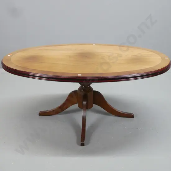 walnut and elm oval coffee table pedestal base with 4 sweeping reeded legs, cross-banded edge, some fading & heat marks