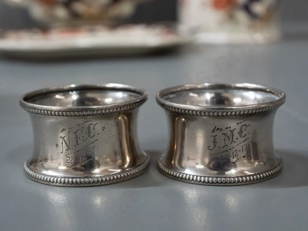 group of assorted sterling silver items - 2 napkin rings with 1917 inscriptions, small pill box and 2 cut glass salts Image 1++