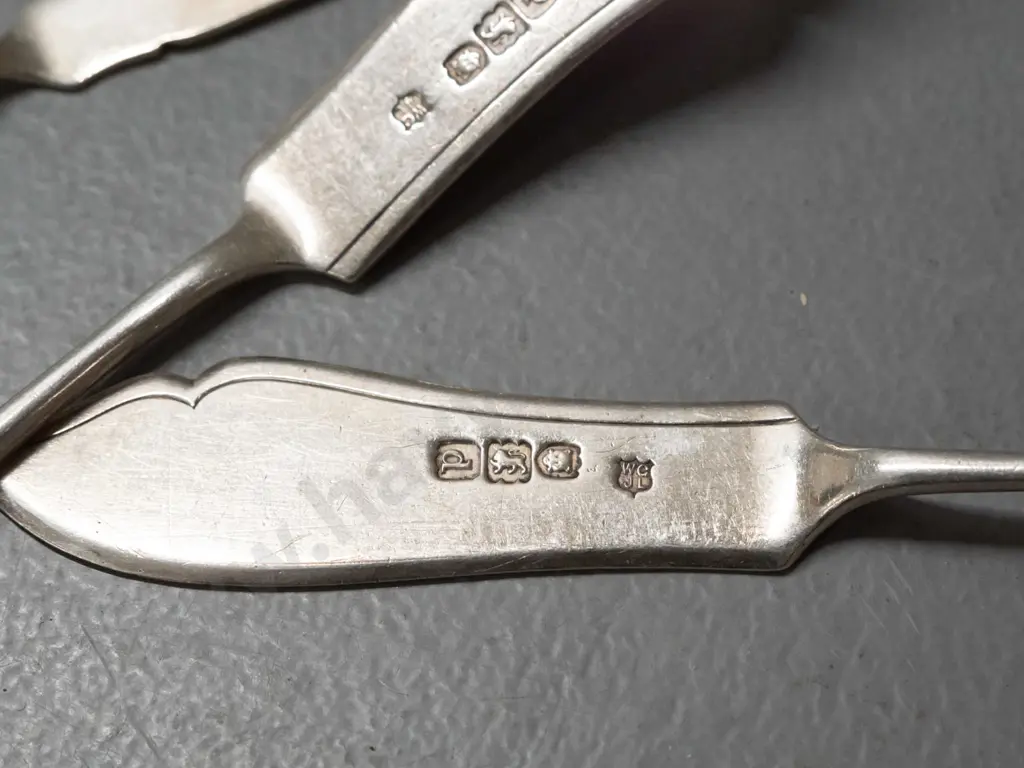 sterling silver butter knives, spoon with notched hook in handle and sugar scoop - all have hallmarks. Scoop is L-150 Image 1++