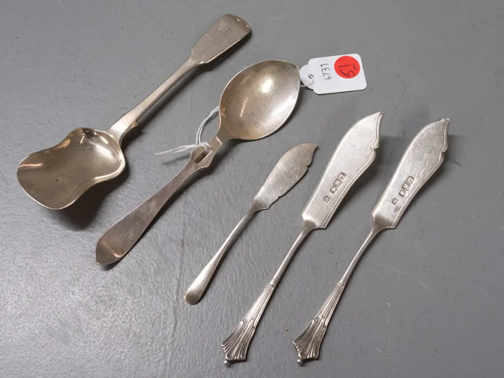 sterling silver butter knives, spoon with notched hook in handle and sugar scoop - all have hallmarks. Scoop is L-150 Image 1++