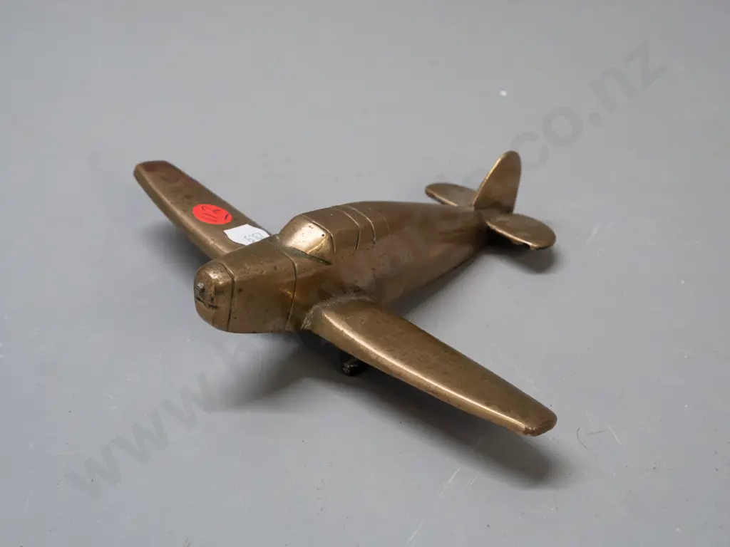 solid cast brass aeroplane model with black painted underside, missing propellor, some pitting and age wear L-160 W-190 Image 1++