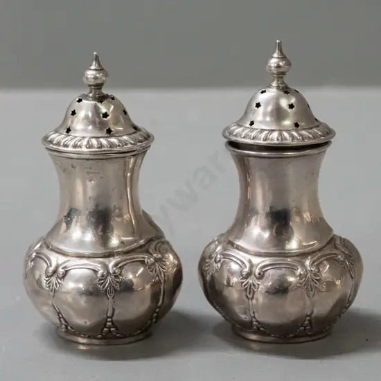 2 sterling silver condiments / shakers with pierced lids - base and lids hallmarked, also marked 'K' on base H-85 - some