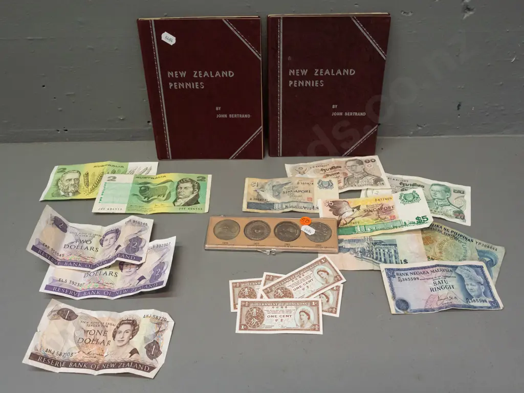 assorted coins & notes - 2 NZ penny albums, set of 4 Australian 50 cent coins, and Australian, NZ and asian bank notes Image 1++