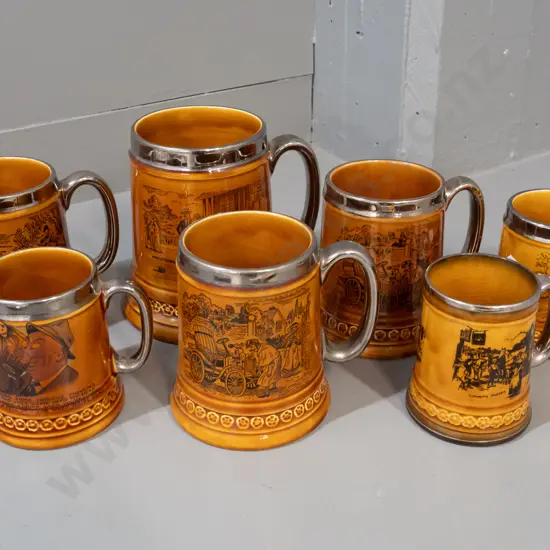 7 brown glaze tankards with silvered rims and handles, 6 are Lord Nelson pottery, smallest is Ridgways Coaching Days,