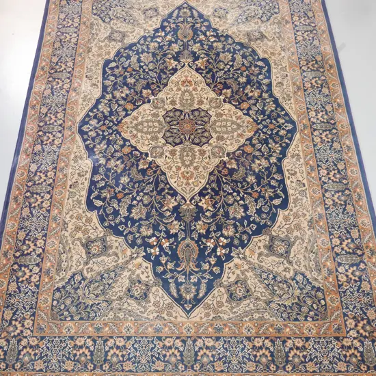Persian style wool floor rug in blues and browns - some areas of fading L-2350 W-1600