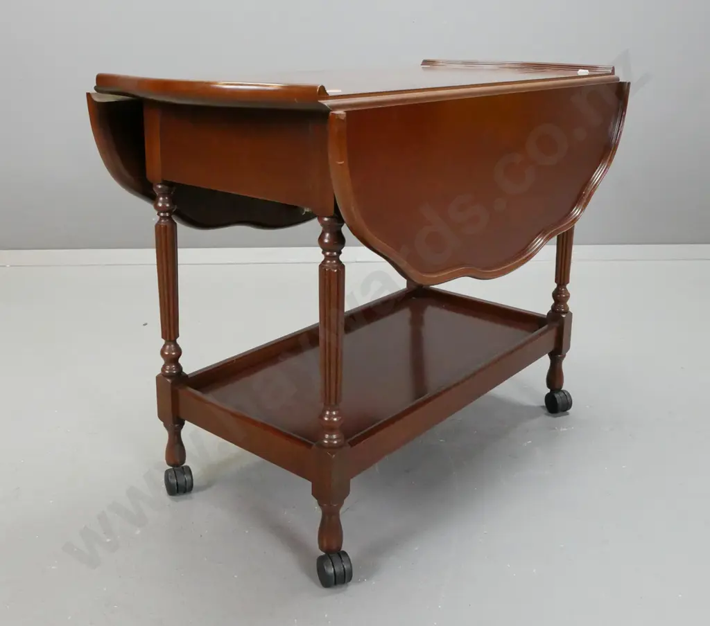 retro drop side tea trolley with serpentine shaped top, fluted turned supports, bottom shelf, on nylon casters - leaves Image 1++