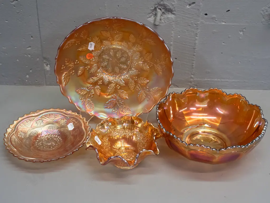 4 marigold carnival glass footed dishes - smallest one has windmill motif. Widest is H-60 W-220 Image 1++