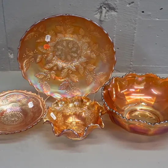 4 marigold carnival glass footed dishes - smallest one has windmill motif. Widest is H-60 W-220