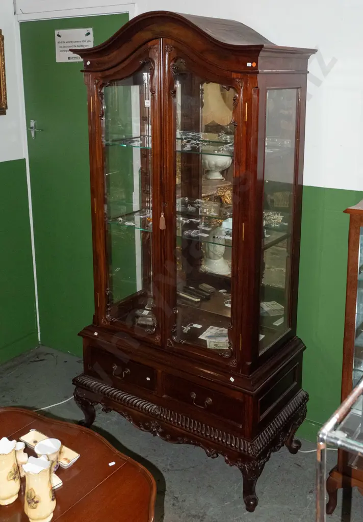 reproduction northern European style Indonesian mahogany glazed display case w/ 2 shaped glazed doors, 2 adjustable Image 1++