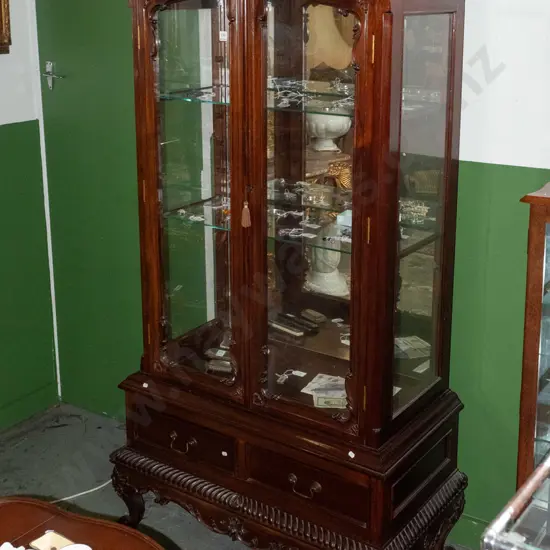 reproduction northern European style Indonesian mahogany glazed display case w/ 2 shaped glazed doors, 2 adjustable