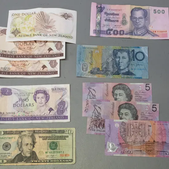assorted bank notes in used condition - NZ $1 x 3 and $2, Australian 3 x $5 and $10, USA $20, etc.